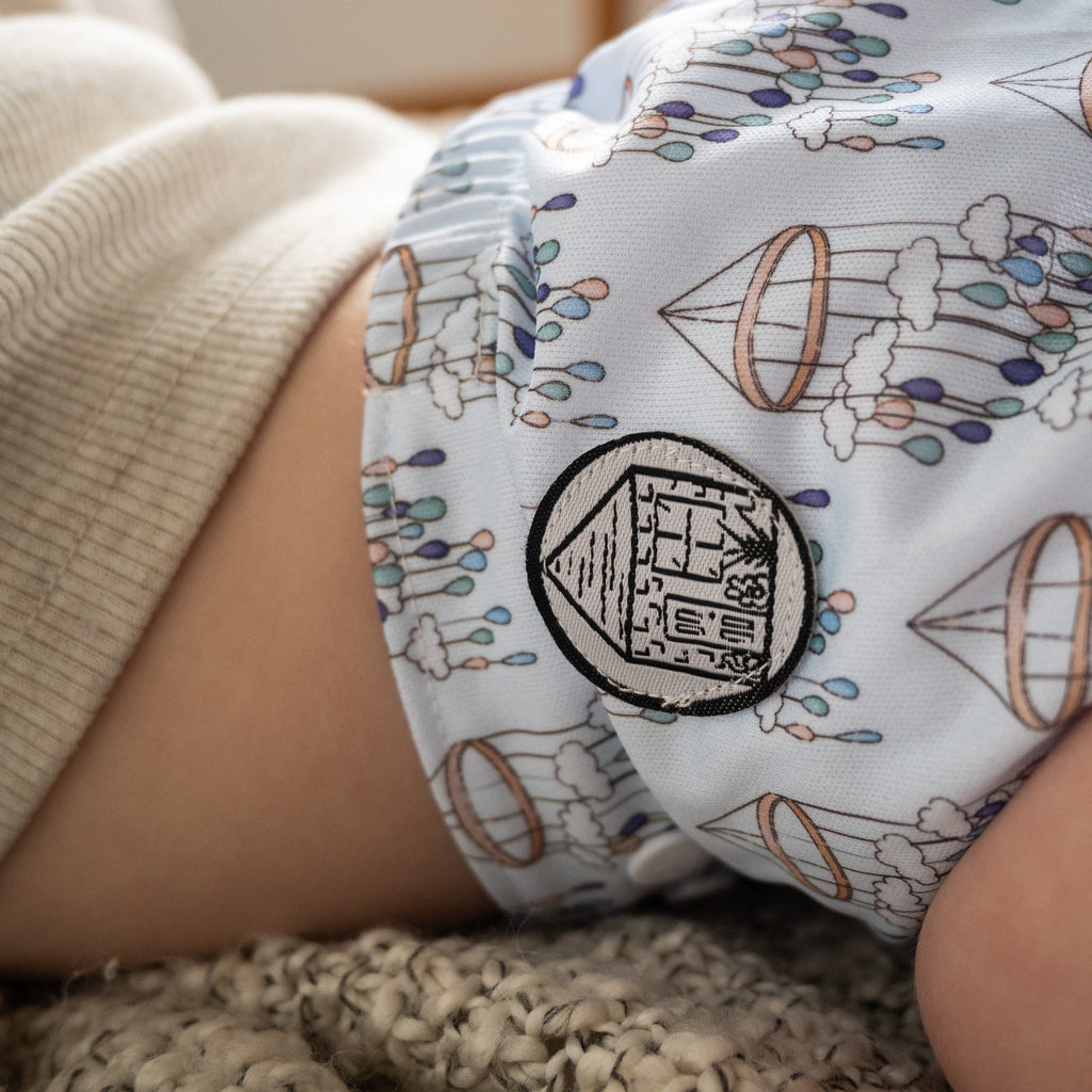 Child wears a Stout House cloth diaper